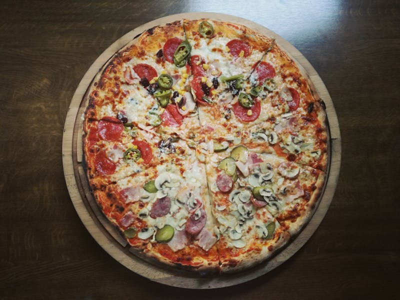 A trio of assorted pizzas